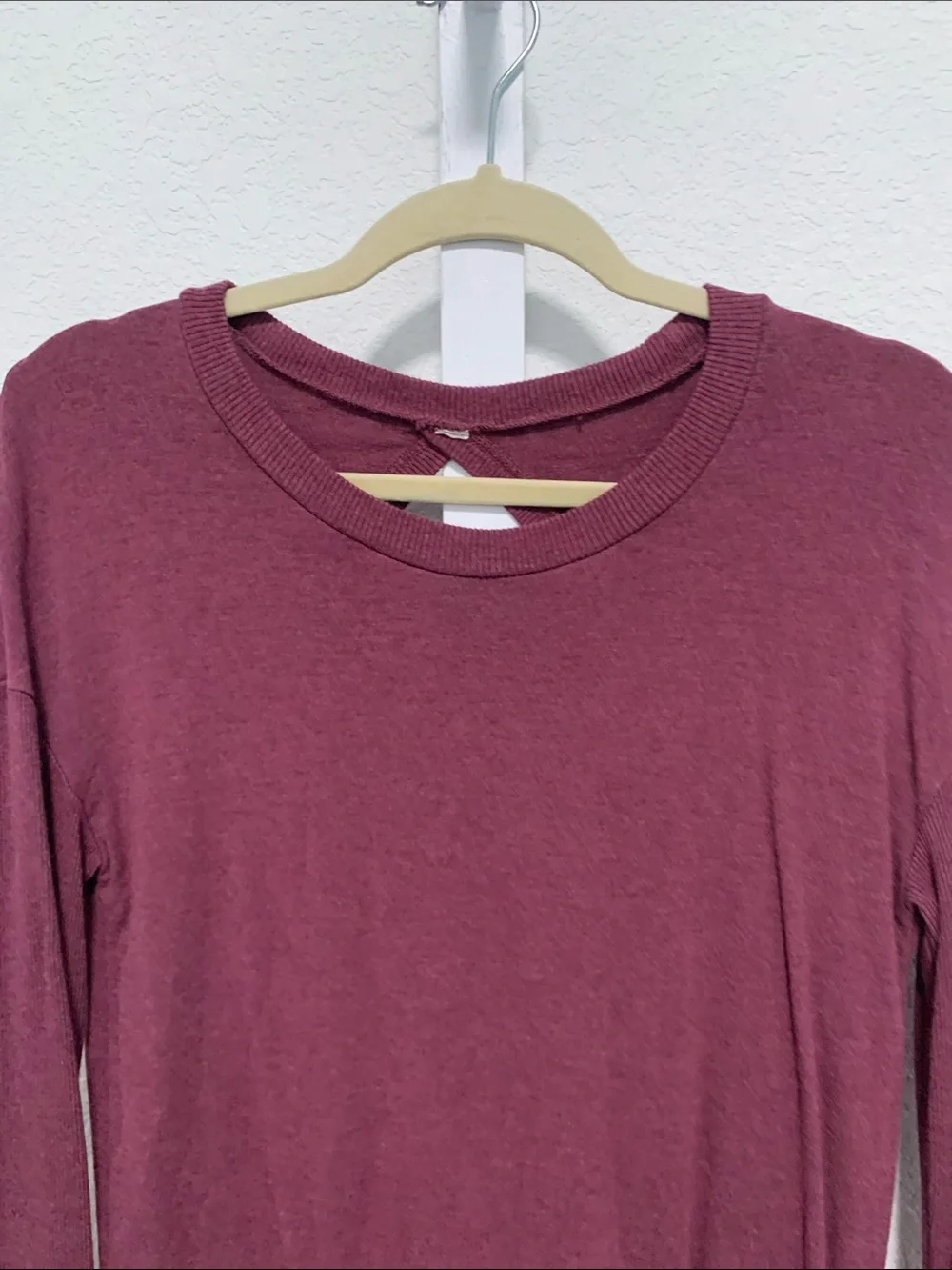 Alo Yoga Intricate Long-Sleeve Cut Out Back Crewneck Top in Wine